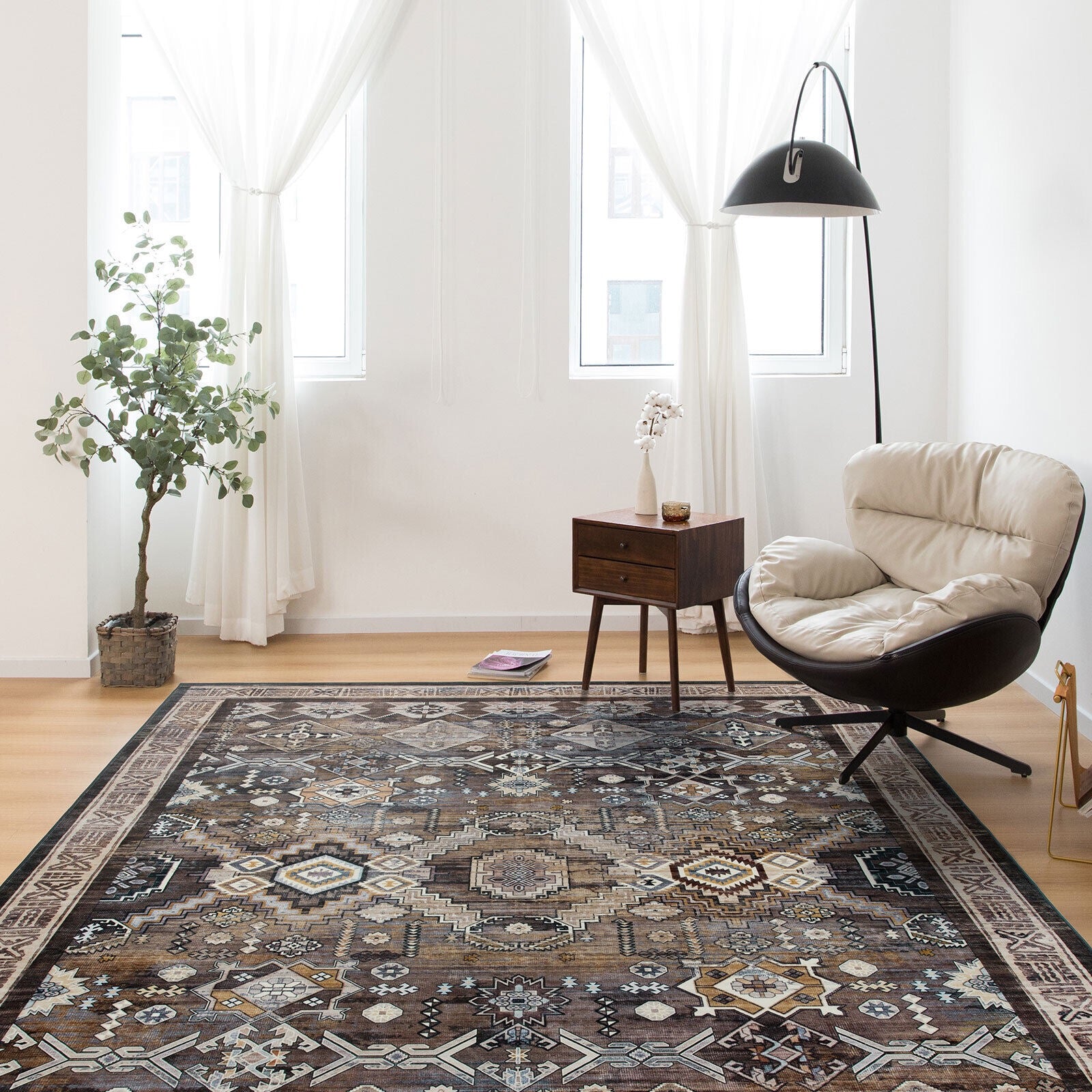 Living room with a patterned rug, chair, and side table.